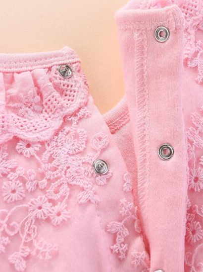 Baby set features a onesie with a tulle skirt, matching shoes, and cap