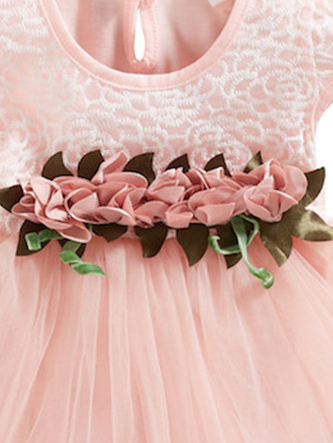 Baby Spring dress has an embroidered bodice, applique flowers at the waistline, and a hi-lo tulle skirt