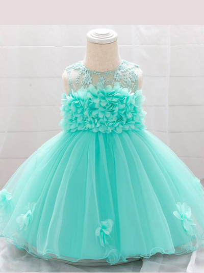 The dress has a bodice with flower applique and tulle skirt