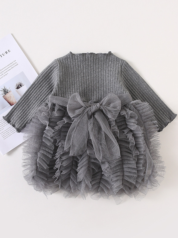 Baby Spring sweater dress features long sleeves with a ruffled tulle skirt and front bow