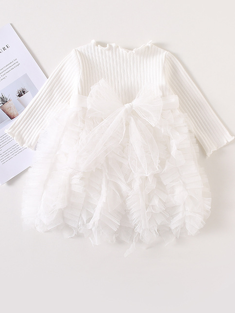 Baby Spring sweater dress features long sleeves with a ruffled tulle skirt and front bow