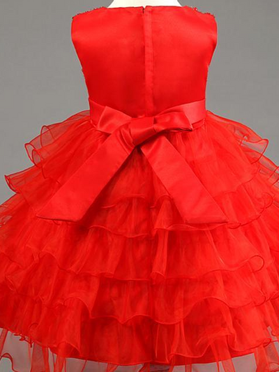 Baby tulle dress bodice has a delicate pearl detail with a bow at the waistline and a multilayer tulle skirt
