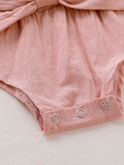 Baby boho style onesie has ruffled long sleeves and a cute bow at the front