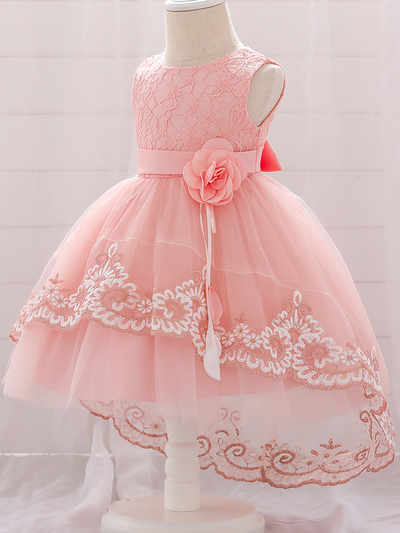 Baby dress has embroidered tulle overlay bodice and hi-lo tulle overlay skirt, removable big bow accent at the back and flower applique at the front