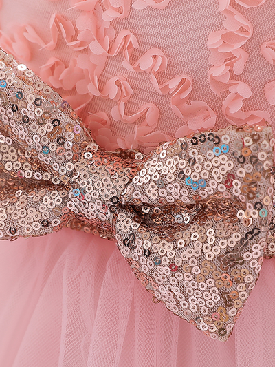 Baby dress has a floral bodice, a tulle skirt with floral hem, and a gold sequin belt with bow at the front and back