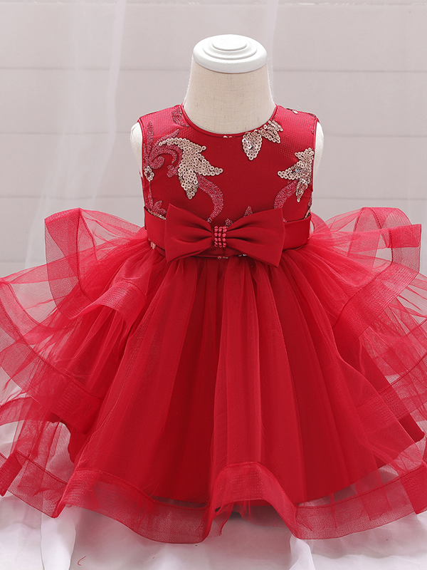 Baby princess dress has a satin bodice with sequin applique, a bow belt at the waist, and a layered tulle skirt