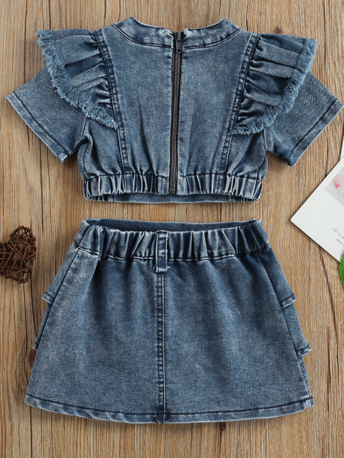 Girls two-piece denim set features a flutter sleeve cropped top with a back zipper and a ruffled skirt