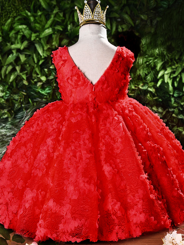 Baby tulle dress' bodice has a delicate flower applique in tulle, has a multicolor layered skirt and bow at the back