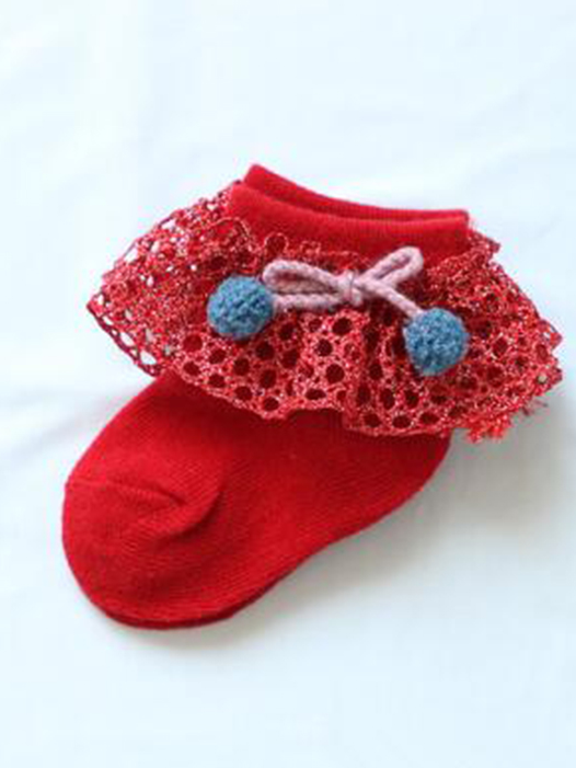 Baby socks with crochet and pompom details