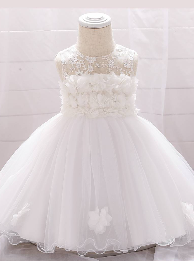 The dress has a bodice with flower applique and tulle skirt