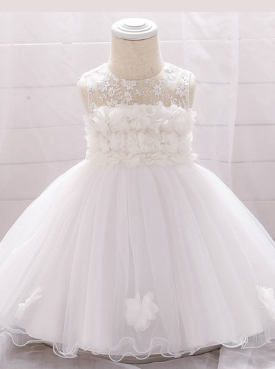 The dress has a bodice with flower applique and tulle skirt