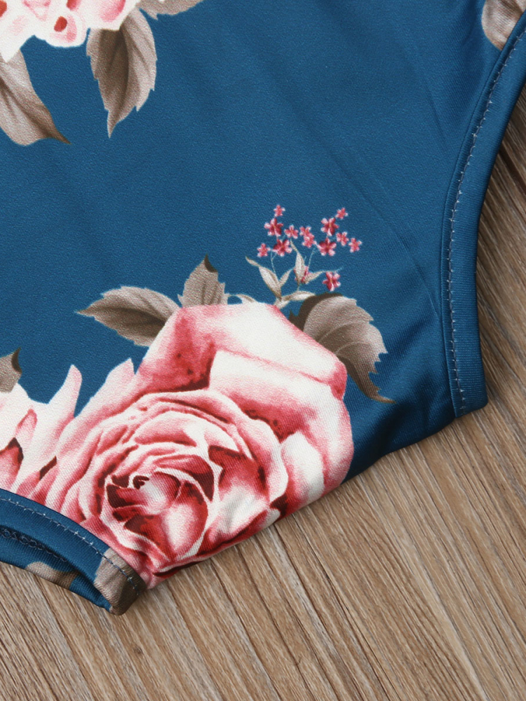 Baby set features a long-sleeved set with floral print with matching socks and a headband