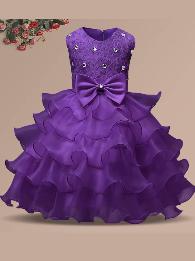 Baby princess dress has a floral lace bodice with rhinestone details, a bow belt at the waist, and a multi-layered tulle skirt