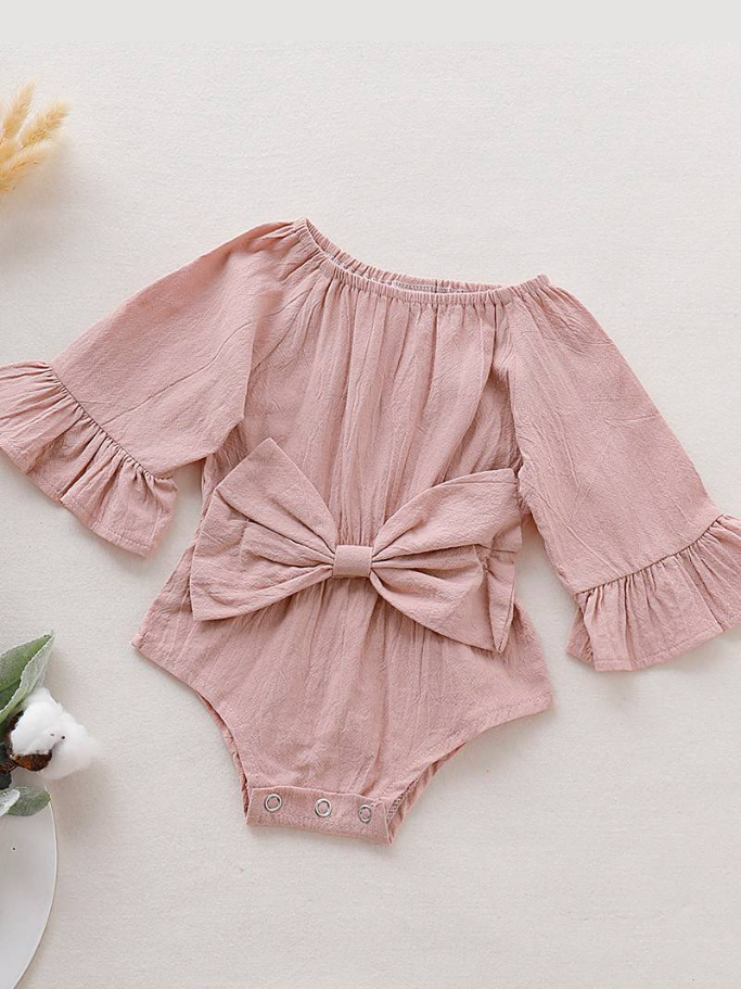 Baby boho style onesie has ruffled long sleeves and a cute bow at the front