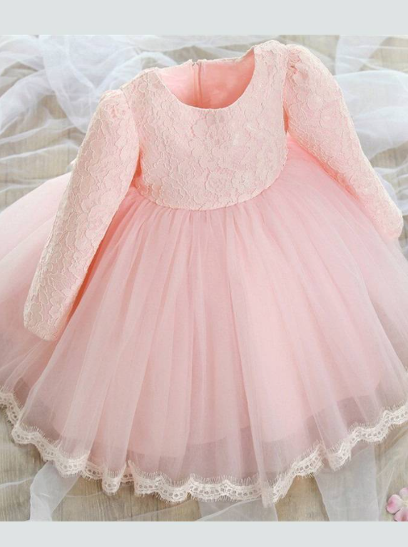 Baby Spring dress has a long-sleeved lace bodice and layered tulle skirt with a big bow the back