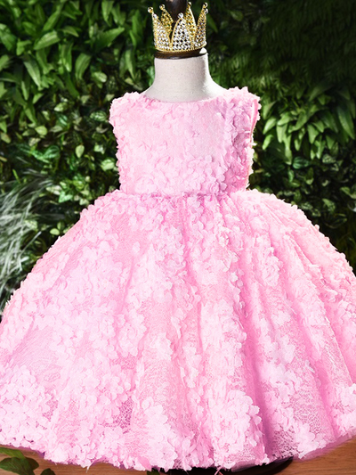 Baby tulle dress' bodice has a delicate flower applique in tulle, has a multicolor layered skirt and bow at the back