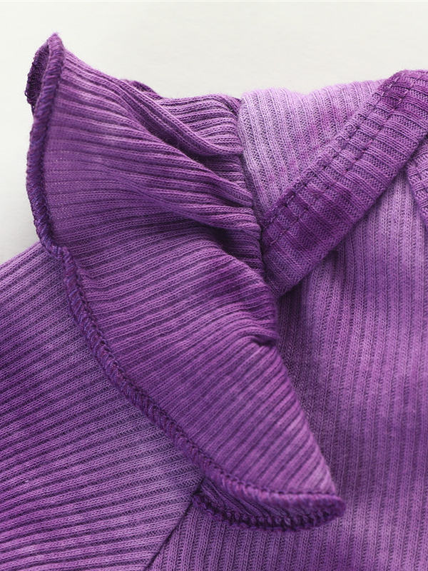 Baby set features a tie-dye long-sleeved onesie with ruffled shoulders, ruffled leggings, and matching headbands