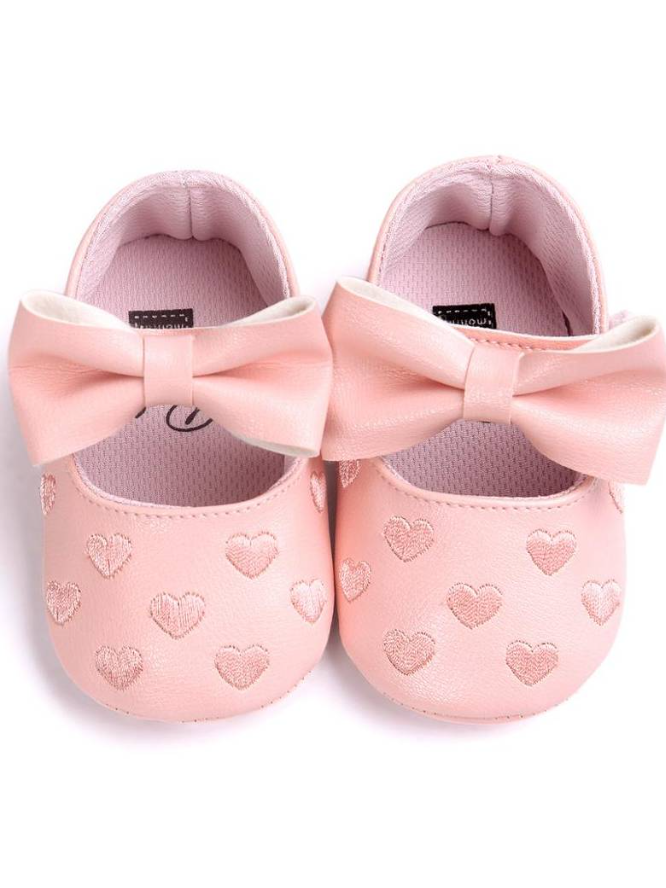 Baby set features a onesie with a tulle skirt, matching shoes, and cap