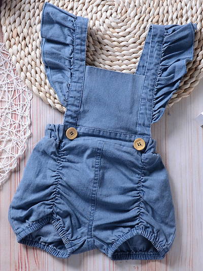 Baby overall style romper onesie has ruffled shoulder straps that tie on the back. has 2 little buttons on the front to make it even more stylish