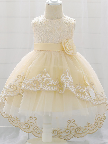 Baby dress has embroidered tulle overlay bodice and hi-lo tulle overlay skirt, removable big bow accent at the back and flower applique at the front