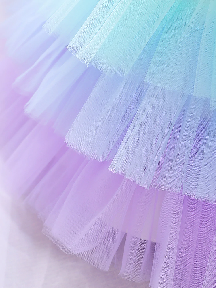 Baby Spring tulle dress' bodice has a delicate flower applique in tulle, has a multicolor layered skirt and bow at the back