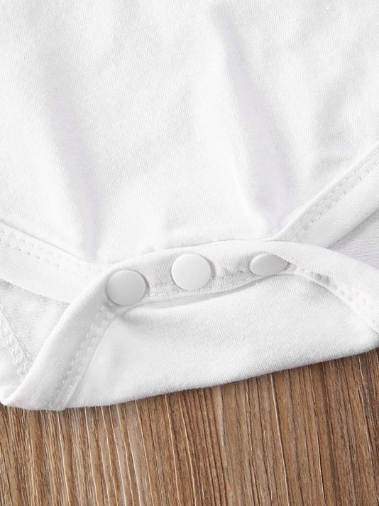 Baby set features a ruffled top with an " I got it from my Mama" print onesie and leopard skirted bloomers with a headband