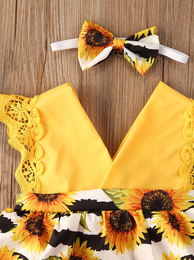 Baby yellow romper onesie with a skirt overlay with sunflower print and matching headband