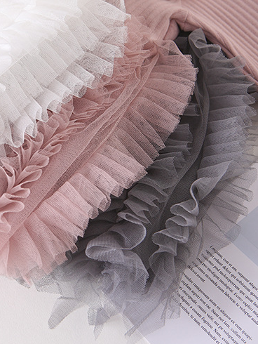 Baby Spring sweater dress features long sleeves with a ruffled tulle skirt and front bow