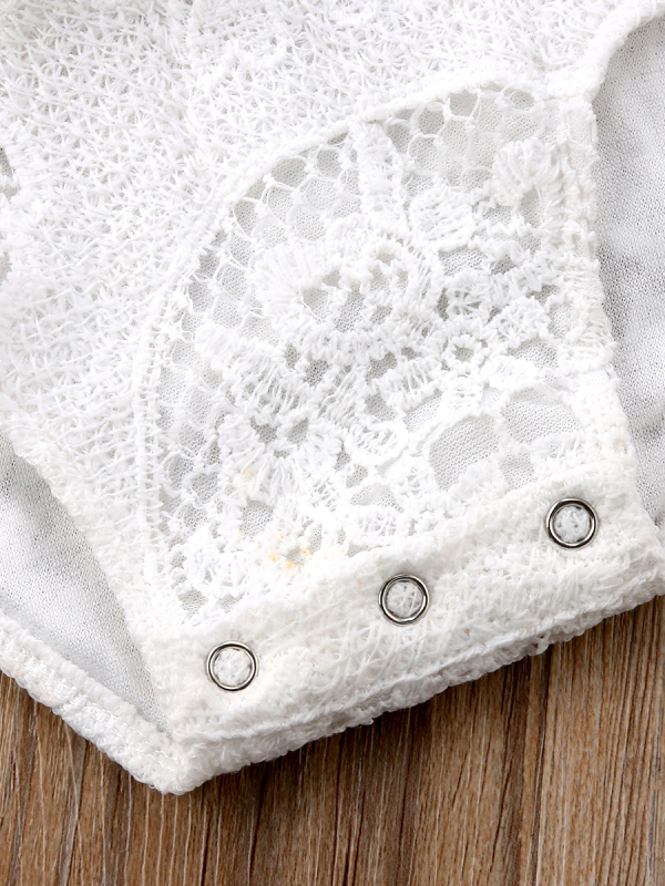 Baby lace onesie has kimono style long sleeves