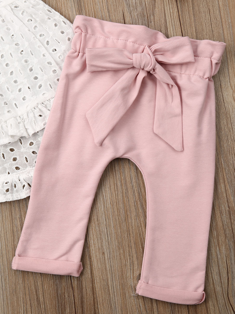 Baby set features an eyelet hi-lo tunic and belted leggings