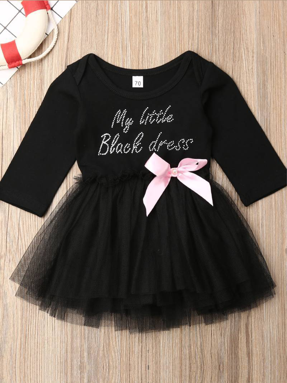 tutu dress has a long sleeved black bodice with "My Little Black Dress" in rhinestones and a tutu skirt