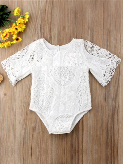 Baby lace onesie has kimono style long sleeves