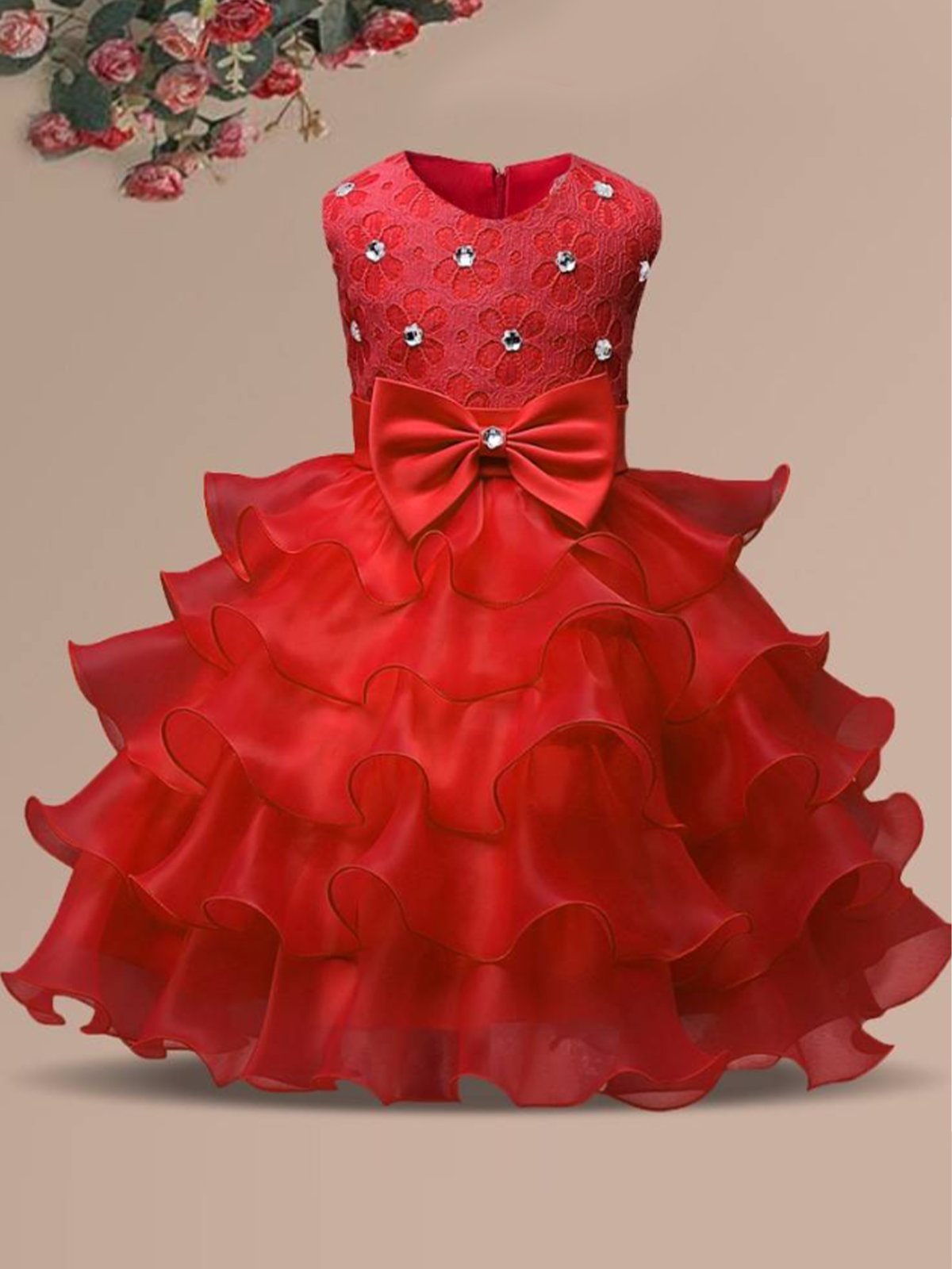 Baby princess dress has a floral lace bodice with rhinestone details, a bow belt at the waist, and a multi-layered tulle skirt