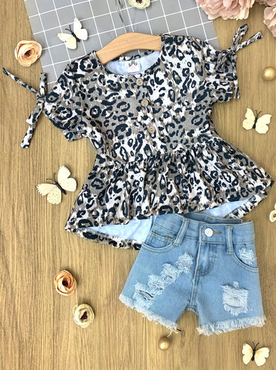 girls set features a leopard printed top with distressed denim shorts