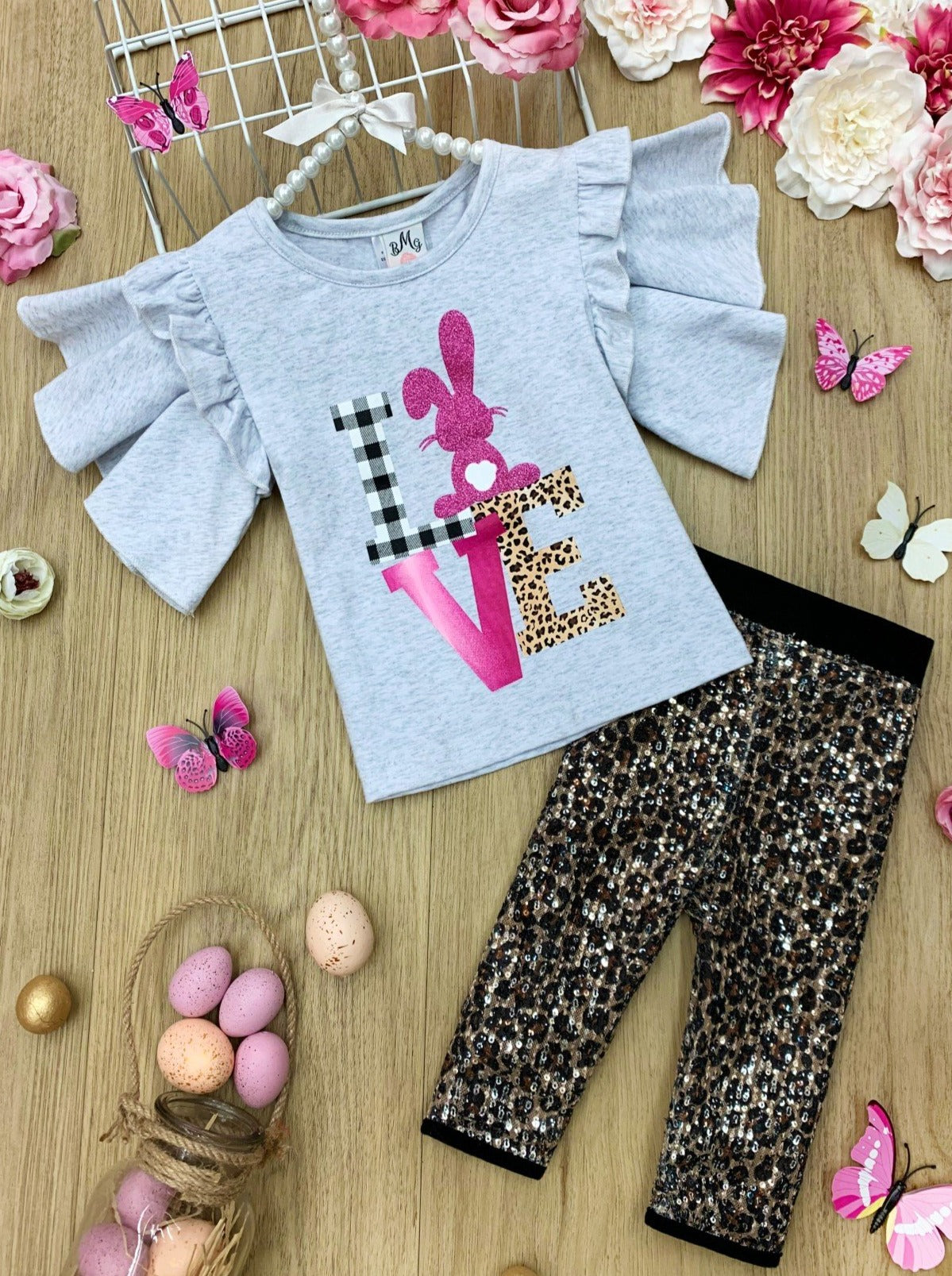 Girls Spring set set features a graphic tee with ruffle sleeves and leopard printed sequin-mesh Bermuda short leggings for 2T to 10Y toddlers and girls