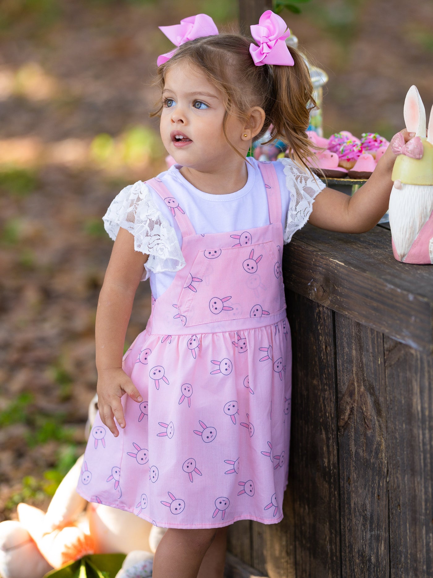 Girls Spring set features a white top with ruffle lace sleeves and an overall skirt with front kangaroo pocket and bunny print for toddlers and girls