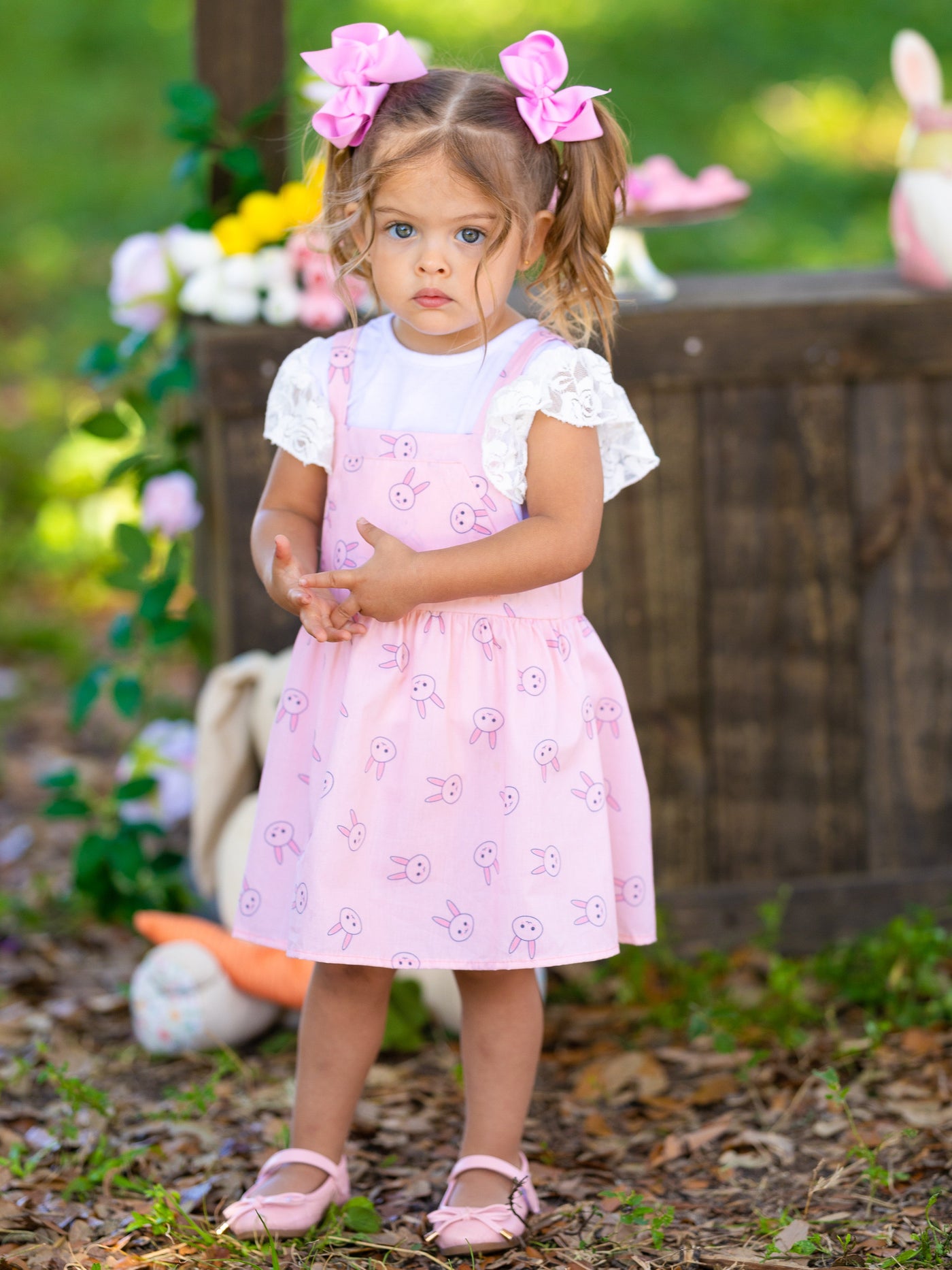Girls Spring set features a white top with ruffle lace sleeves and an overall skirt with front kangaroo pocket and bunny print for toddlers and girls