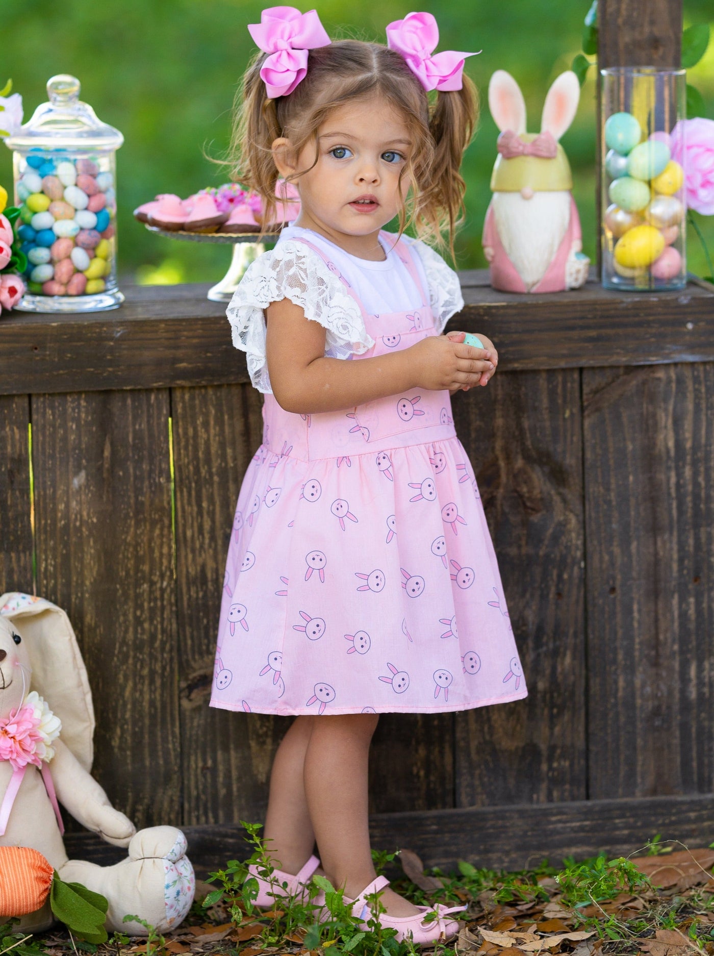 Girls Spring set features a white top with ruffle lace sleeves and an overall skirt with front kangaroo pocket and bunny print for toddlers and girls