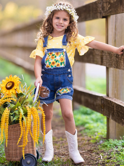 Girls Summer set features a yellow ruffle sleeve top with white polka dots and denim overall shorts with sunflower print and sequin mesh patches - 2T-10Y