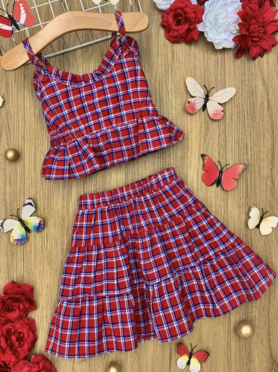 Set features a red/blue Gingham print ruffled crop top with spaghetti straps and a matching skirt