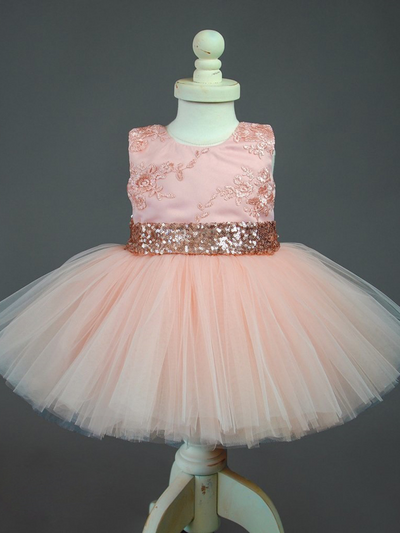 Baby tutu dress has an embroidered floral bodice, a sequin belt at the waistline with a big bow at the back, and a tutu skirt
