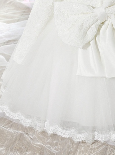 Baby Spring dress has a long-sleeved lace bodice and layered tulle skirt with a big bow the back