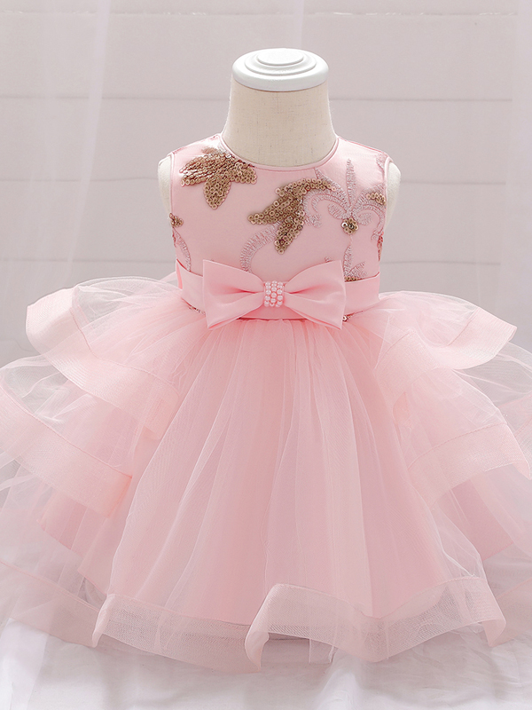 Baby princess dress has a satin bodice with sequin applique, a bow belt at the waist, and a layered tulle skirt 