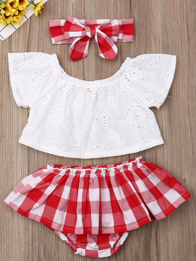 Baby set features an eyelet off-shoulder top and checkered skirted bloomers with a headband