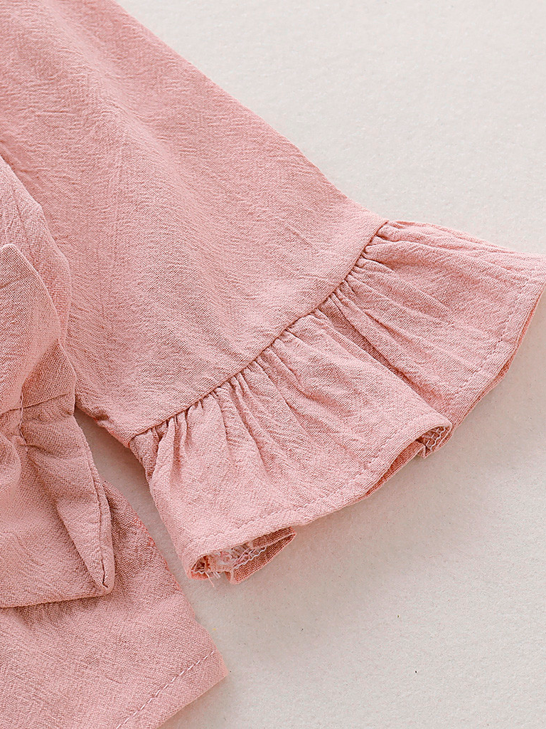 Baby boho style onesie has ruffled long sleeves and a cute bow at the front