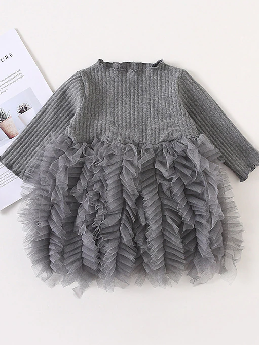Baby Spring sweater dress features long sleeves with a ruffled tulle skirt and front bow