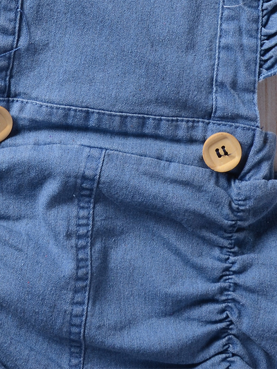 Baby overall style romper onesie has ruffled shoulder straps that tie on the back. has 2 little buttons on the front to make it even more stylish