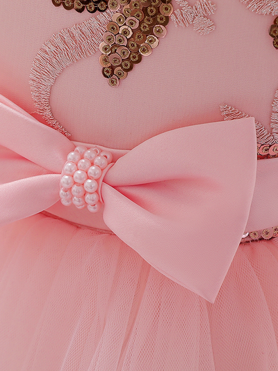 Baby princess dress has a satin bodice with sequin applique, a bow belt at the waist, and a layered tulle skirt 