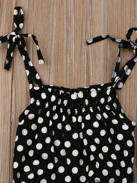 Baby set has a polka dot onesie with adjustable straps, comes with a pink skirt and matching headband