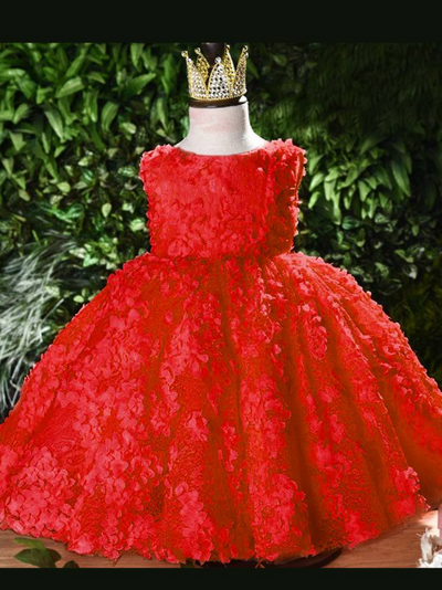 Baby tulle dress' bodice has a delicate flower applique in tulle, has a multicolor layered skirt and bow at the back